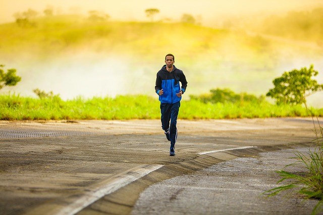 Man running outside just before dusk.